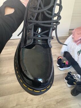 Dr. Martens Black Patent Combat Boots with Yellow Stitching